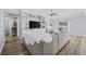 Bright living room featuring built-in shelving and sliding door to the backyard at 649 W Perry Rd., Myrtle Beach, SC 29579