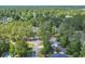 Aerial view of neighborhood with mature trees surrounding single Gathering homes at 6612 Wintergreen Point, Myrtle Beach, SC 29588