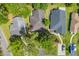 Aerial view of neighborhood shows house with mature trees and nearby street parking at 6612 Wintergreen Point, Myrtle Beach, SC 29588