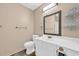 Traditional bathroom featuring a white vanity with gold hardware, a toilet, and towel rack at 6612 Wintergreen Point, Myrtle Beach, SC 29588