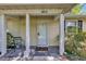 Inviting covered front porch with a chair and 'Welcome' mat, leading to the home's entrance at 6612 Wintergreen Point, Myrtle Beach, SC 29588