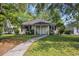 Charming single-story home with a well-maintained lawn, a paved walkway, and mature trees at 6612 Wintergreen Point, Myrtle Beach, SC 29588