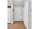 Entryway featuring wood-look floors, a front door, a closet, and access to the kitchen at 6612 Wintergreen Point, Myrtle Beach, SC 29588