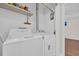 Laundry room features newer washer and dryer units in a well-lit space at 6612 Wintergreen Point, Myrtle Beach, SC 29588