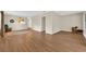 Open-concept living area with wood-look floors and neutral walls at 6612 Wintergreen Point, Myrtle Beach, SC 29588