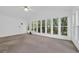 Bright sunroom with lots of windows provides great natural light and views of backyard trees at 6612 Wintergreen Point, Myrtle Beach, SC 29588