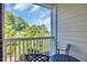 Private balcony offering views of lush greenery and outdoor seating to unwind and relax in peace at 683 Riverwalk Dr. # 302, Myrtle Beach, SC 29579