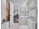 Bathroom featuring a vanity, toilet, and shower with a decorative curtain; view into another room at 683 Riverwalk Dr. # 302, Myrtle Beach, SC 29579