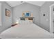 A queen-size bed with a beach-themed headboard and pictures on the walls at 683 Riverwalk Dr. # 302, Myrtle Beach, SC 29579