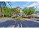 A multi-level condo building surrounded by trees and green shrubs at 683 Riverwalk Dr. # 302, Myrtle Beach, SC 29579
