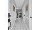 Hallway with white tile flooring leading to the rest of the home at 683 Riverwalk Dr. # 302, Myrtle Beach, SC 29579