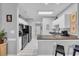 The modern kitchen features stainless steel appliances, granite countertops, and a breakfast bar at 683 Riverwalk Dr. # 302, Myrtle Beach, SC 29579