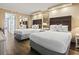 Bright bedroom featuring two queen beds, ambient lighting, and mirrored closet doors, enhancing space and style at 6900 Ocean Blvd. # 935, Myrtle Beach, SC 29572
