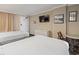 Comfortable bedroom with two beds, a dresser, and a TV, perfect for relaxation and entertainment at 6900 Ocean Blvd. # 935, Myrtle Beach, SC 29572