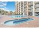 Outdoor pool area featuring plenty of lounge chairs and a splash pool at 6900 Ocean Blvd. # 935, Myrtle Beach, SC 29572