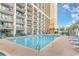 Pool with plentiful chaise lounge seating near building at 6900 Ocean Blvd. # 935, Myrtle Beach, SC 29572