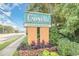 Entrance sign to a resort showing lush landscaping and views of the entrance at 6900 Ocean Blvd. # 935, Myrtle Beach, SC 29572
