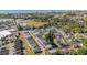 An aerial view captures community's layout with residential streets, pool, pond, and surrounding commercial areas at 708 Ashland Ave., North Myrtle Beach, SC 29582
