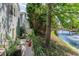 Serene backyard featuring a patio, waterfront view, and lush landscaping at 708 Ashland Ave., North Myrtle Beach, SC 29582