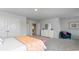 Spacious bedroom with a bed dressed in peach and pink bedding, dresser and sitting area, plus generous closet space at 733 Choctaw Dr., Conway, SC 29526