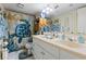 Bathroom featuring double sinks, turtle themed shower curtain, and ample storage at 806 Conway St. # 116, North Myrtle Beach, SC 29582
