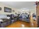 Inviting living room with hardwood floors, comfortable seating, and an open layout with the kitchen visible at 806 Conway St. # 116, North Myrtle Beach, SC 29582