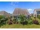 Backyard aerial view showcasing landscaping, including a covered patio with a pergola at 808 Atlantic Commons Dr., Surfside Beach, SC 29575