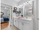 Bathroom featuring double sinks, vanity lighting, and bedroom view at 808 Atlantic Commons Dr., Surfside Beach, SC 29575