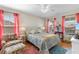 Charming bedroom with bright windows, a decorative bed, and a comfortable armchair at 808 Atlantic Commons Dr., Surfside Beach, SC 29575