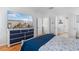 Bedroom with large TV, wood floors and an ensuite bathroom at 808 Atlantic Commons Dr., Surfside Beach, SC 29575