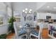 Charming dining area with a glass-top table, stylish chairs, and natural light at 808 Atlantic Commons Dr., Surfside Beach, SC 29575