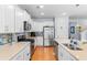 Well-appointed kitchen featuring white cabinets, stainless appliances, and quartz countertops at 808 Atlantic Commons Dr., Surfside Beach, SC 29575