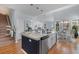 Spacious open-concept kitchen with island, white cabinets, and seamless flow into the living area at 808 Atlantic Commons Dr., Surfside Beach, SC 29575