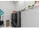 Functional laundry room with modern washer/dryer and ample storage cabinets at 808 Atlantic Commons Dr., Surfside Beach, SC 29575