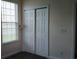 Bedroom with a window and closet with double doors at 843 Brookline Dr., Myrtle Beach, SC 29579