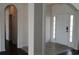 Inviting foyer featuring tile flooring, a bright front door with sidelights, and arched doorways to adjacent spaces at 843 Brookline Dr., Myrtle Beach, SC 29579