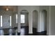 Welcoming foyer showcasing arched entryways, tile flooring, and a bright front door, creating a warm ambiance at 843 Brookline Dr., Myrtle Beach, SC 29579