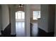 Spacious interior view featuring arched doorways, hardwood floors, and ample natural light streaming through the windows at 843 Brookline Dr., Myrtle Beach, SC 29579
