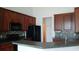 Modern kitchen features dark cabinetry, black appliances, and stylish backsplash at 843 Brookline Dr., Myrtle Beach, SC 29579