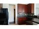 Kitchen with dark cabinets, mosaic backsplash, and stainless steel sink at 843 Brookline Dr., Myrtle Beach, SC 29579