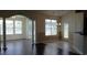 Bright living room with hardwood floors, arched doorway, and large windows at 843 Brookline Dr., Myrtle Beach, SC 29579
