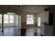 Bright living room with hardwood floors, arched doorway, and modern chandelier at 843 Brookline Dr., Myrtle Beach, SC 29579