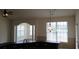 Bright and airy living room with decorative archway and abundant natural light through large windows at 843 Brookline Dr., Myrtle Beach, SC 29579