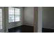Bright and airy living space with large windows, hardwood floors, and versatile layout, ideal for relaxing and entertaining at 843 Brookline Dr., Myrtle Beach, SC 29579