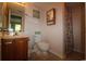 Bathroom with vanity, toilet, shower with curtain and mirrored medicine cabinet above toilet at 861 Tall Oaks Ct. # D-61, Myrtle Beach, SC 29588