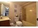 Bathroom features vanity, toilet, shower with tub and shower curtain, with decorative wall art at 861 Tall Oaks Ct. # D-61, Myrtle Beach, SC 29588