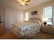 Cozy bedroom featuring a ceiling fan, bedside lamps, and windows with blinds at 861 Tall Oaks Ct. # D-61, Myrtle Beach, SC 29588