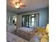 Bedroom with two twin beds, sliding glass door to porch, and a side table with lamp at 861 Tall Oaks Ct. # D-61, Myrtle Beach, SC 29588