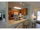 Efficient kitchen with oak cabinets, modern appliances, breakfast bar, and tiled flooring at 861 Tall Oaks Ct. # D-61, Myrtle Beach, SC 29588