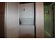 Stacked washer and dryer unit in closet with louvered door at 861 Tall Oaks Ct. # D-61, Myrtle Beach, SC 29588